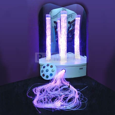 an electronic device with purple lights on it's side and some wires in front of it