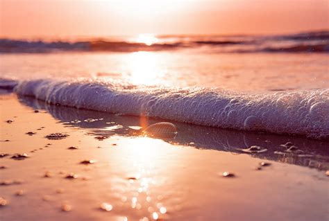 Beautiful Relaxing Ocean Beach Sand And Waves At Sunset Photograph by ...