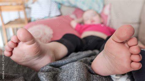 Close up of baby girl's foot sleeping on a couch. Stock Photo | Adobe Stock