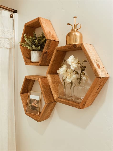 Hexagon Shelves | Hexagon shelf decor, Shelf decor living room, Craft ...