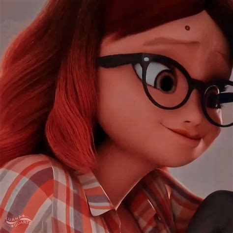 a close up of a person wearing glasses with red hair and black rimmed glasses