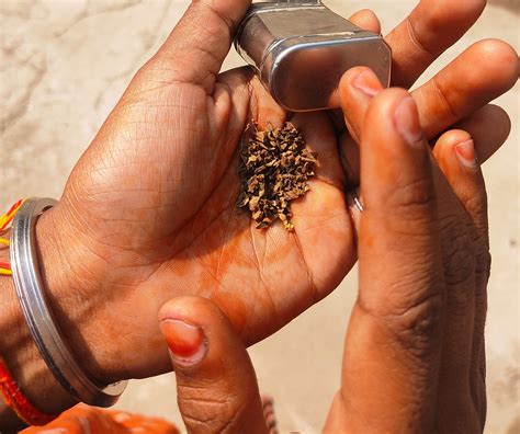 Indian Man Teaches Ugandan Local How To Eat 'Khaini'