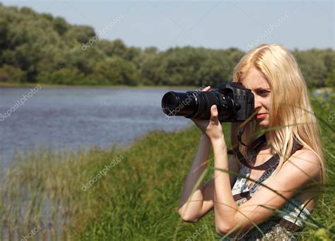 Girl photographer on the nature. — Stock Photo © yykkaa #6470396