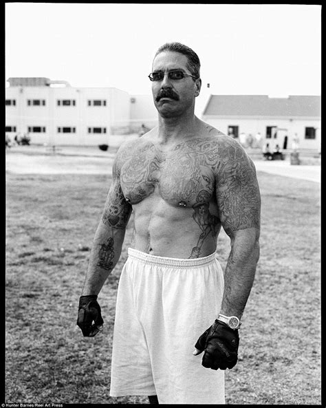 Muscles: A prisoner at a California state prison poses dressed just in ...