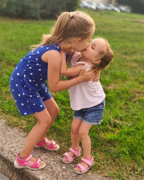 adorable sisters kissing each other | Cute little girl dresses, Little girl swimsuits, Beautiful ...