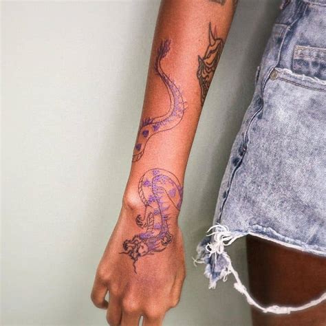 Dragon Tattoo Around Wrist by @inky_tattoo_h - Tattoogrid.net