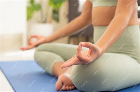 Premium Photo | Woman practicing yoga breathing and meditating doing ...