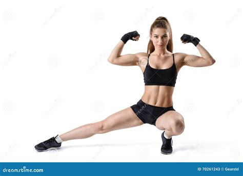 Portrait of Strong Muscular Woman Flexing Her Biceps and Stretching Leg. Cutout Fitness Girl ...