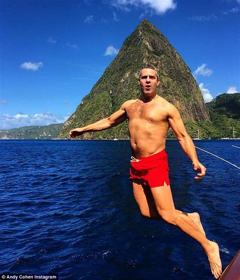 Andy Cohen shows off his toned physique while on a tropical holiday ...