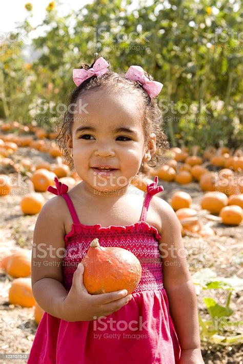 Girl In The Pumpkin Patch Stock Photo - Download Image Now - American ...