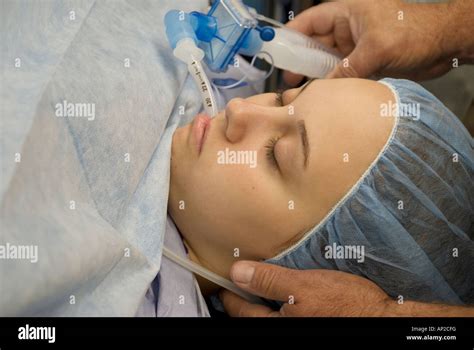 Female teenage patient under anesthesia during surgical procedure Stock Photo, Royalty Free ...