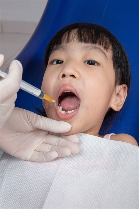 Asian Chinese Little Girl Lying Down for Tooth Extraction Stock Image - Image of girl, asian ...