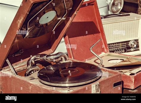 Vintage vinyl record player by the retro car Stock Photo - Alamy