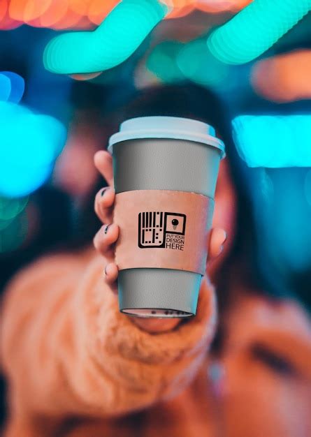 Premium PSD | Girl Holding a Coffee Cup Mockup