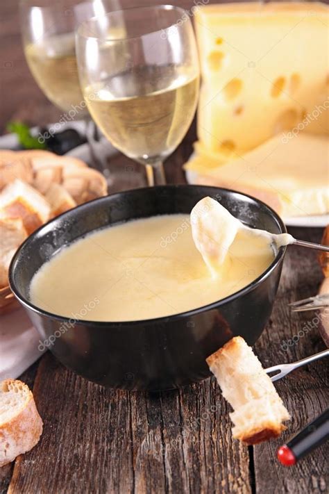 Cheese fondue with white wine — Stock Photo © studioM #78126114