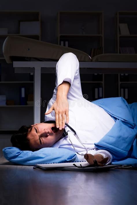 The Doctor Working Night Shift in Hospital after Long Hours Stock Image - Image of floor, laying ...