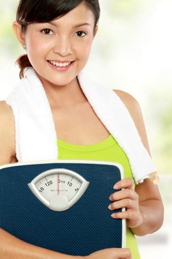 Woman With Weight Scale Stock Photo - Download Image Now - Adult, Adults Only, Asian and Indian ...