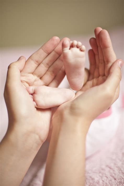 Baby Legs In Mother's Arms Free Stock Photo - Public Domain Pictures