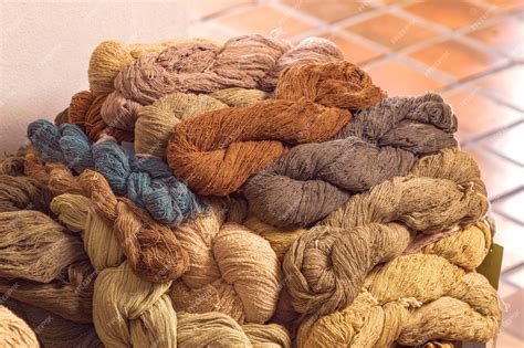 Premium Photo | Pile of natural color dyed cotton yarn for weaving in ...