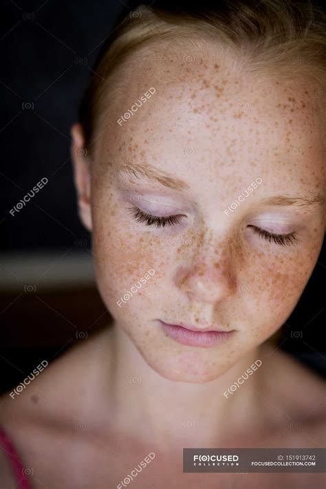Portrait of girl with freckles and eyes closed — indoors, female - Stock Photo | #151913742