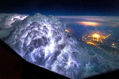Amazing snaps taken from plane cockpits show thunderstorms light up the insides of clouds Fly ...