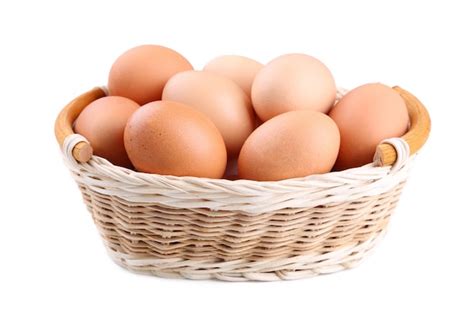 Premium Photo | Fresh chicken eggs in basket on grey wooden background