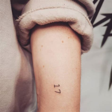 Hand poked number "17" tattoo done on the wrist.