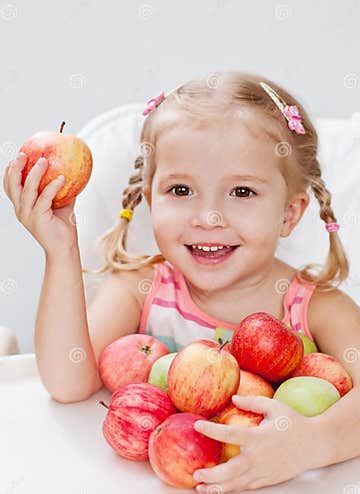 Happy Little Girl with Apple Stock Image - Image of apple, hand: 33835855