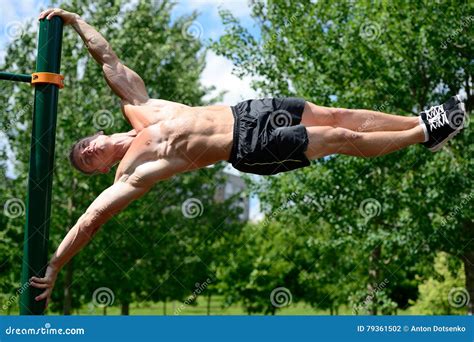 Muscular Man Practice Street Workout In An Outdoor Gym Stock Photo - Image of force, handsome ...