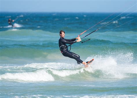 Man Parasailing While Wearing Wetsuit · Free Stock Photo