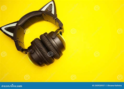 Black Wireless Headphones Isolated on Yellow Background. a Cosplay Accessory. Wireless Gaming ...