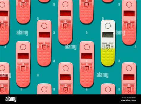 Pattern image of DECT phones turning into a toy phones on blue background. The concept of ...