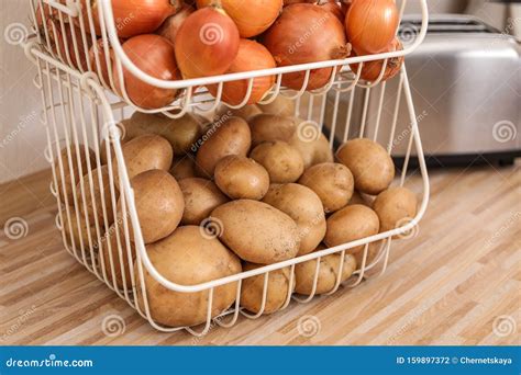 Container with Potatoes and Onions on Kitchen Counter. Orderly Storage Stock Photo - Image of ...