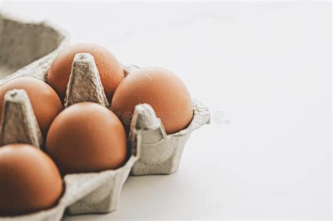 Organic Eggs in Egg Box on White Marble Kitchen Table Stock Photo ...