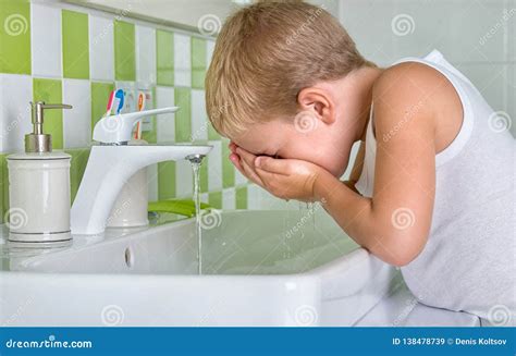 Man Wash His Face In Bathroom Royalty-Free Stock Photography | CartoonDealer.com #148280123