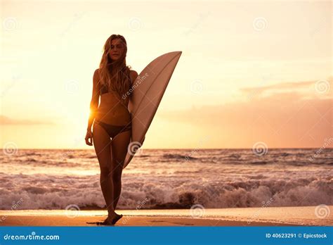 Silhouette Surfer Girl on the Beach at Sunset Stock Image - Image of ...