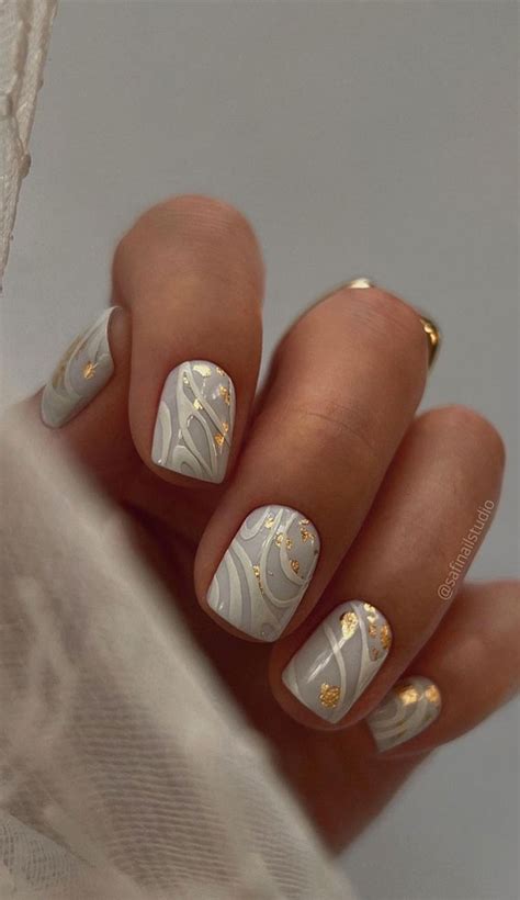 35 Nail Trends 2023 To Have on Your List : White Swirl Short Nails