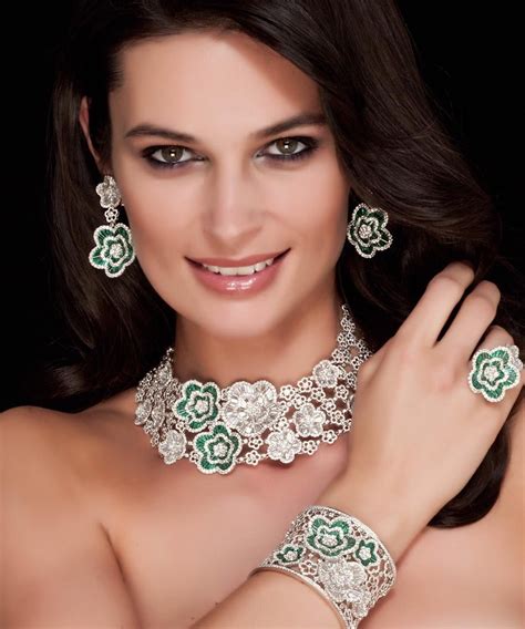 Handmade Suite from the 'La Fleur' Haute Joaillerie Collection enhanced by Taper Cut Emeralds ...