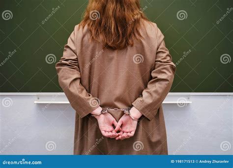 Teacher Hands in Handcuffs in the School Classroom Stock Image - Image ...