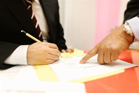 Close-Up Shot of a Person Writing on a Paper · Free Stock Photo