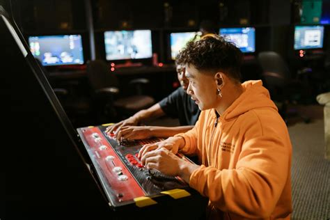 Two Men Playing an Arcade Video Game · Free Stock Photo