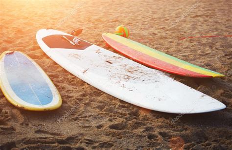 Surfboards lying on the beach — Stock Photo © GaudiLab #69202675