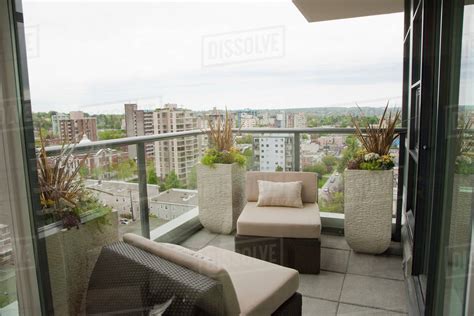 Highrise apartment balcony overlooking city - Stock Photo - Dissolve