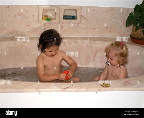 Bathtime siblings hi-res stock photography and images - Alamy