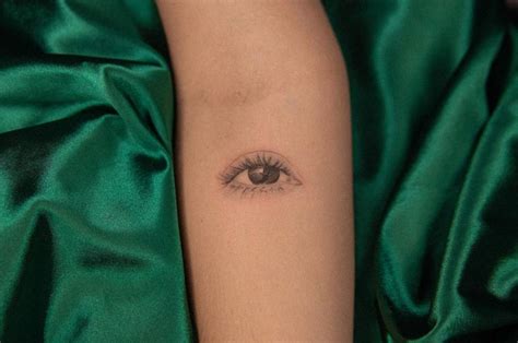 Micro-realistic eye tattoo located on the inner