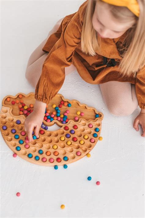 Wooden Rainbow sorting toy - Woodinout © Montessori toys