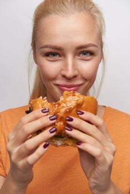 Eating Junk Food Stock Photos, Images and Backgrounds for Free Download