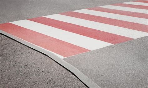 Premium Photo | Pedestrian crossing with red and white marking