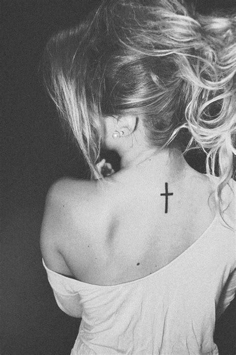 Small Cross on Back Tattoo