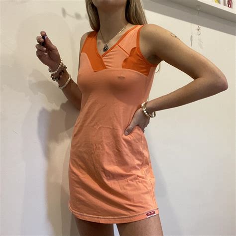 Orange tennis style mini dress best fits sizes:... - Depop